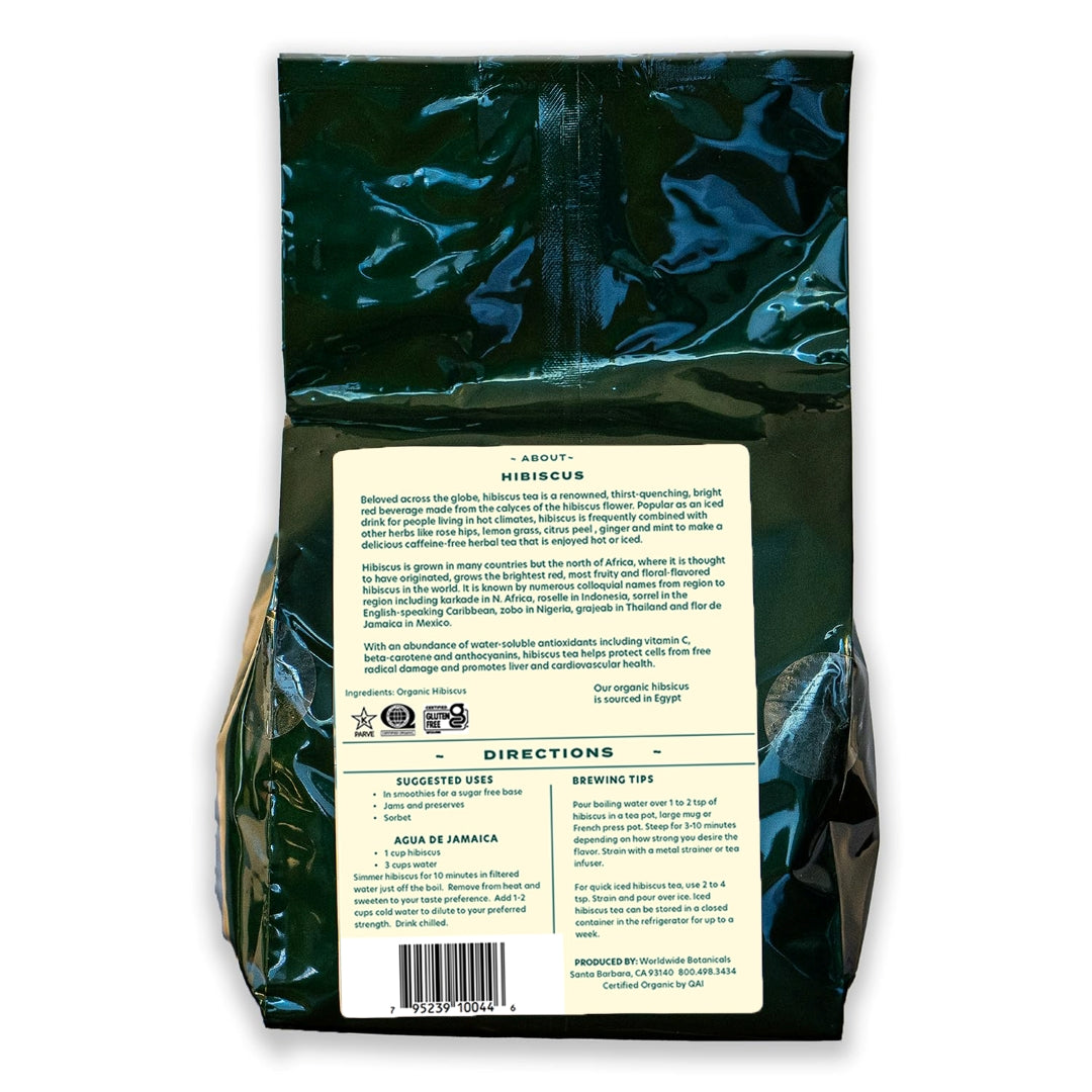 A dark green bag with a light yellow-ish back label filled with organic Egyptian hibiscus.