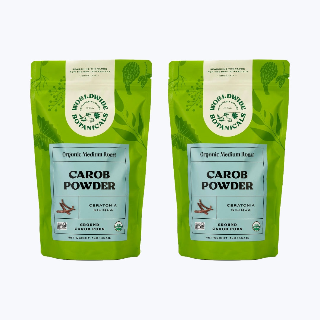 Two lime green bags with light blue front labels filled with 1 pound each organic medium roasted carob powder.