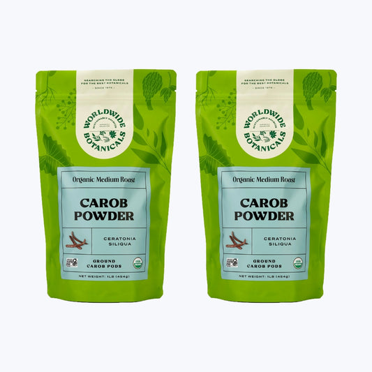 Two lime green bags with light blue front labels filled with 1 pound each organic medium roasted carob powder.