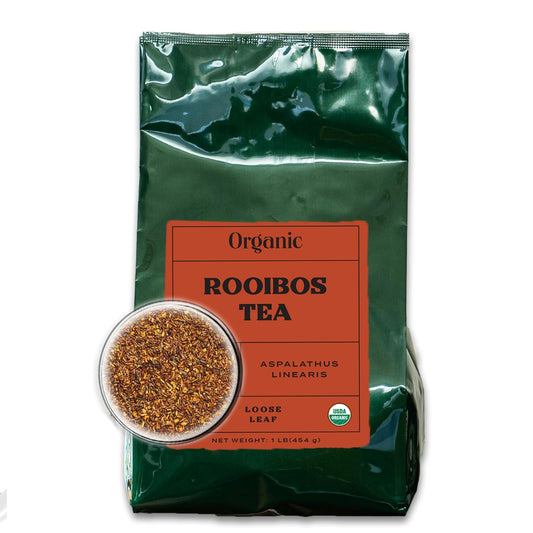 Dark green bag with red-orange front label filled with organic loose leaf rooibos.